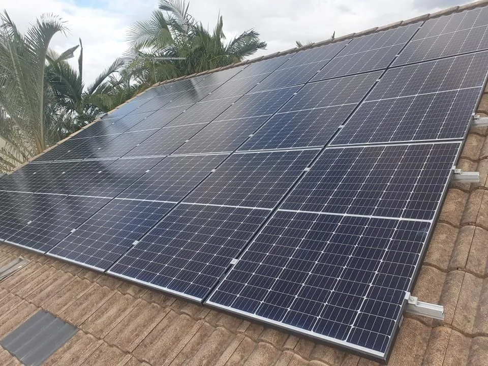 Solar panels on a tiled residential roof installed by D.J. Whatley & Son